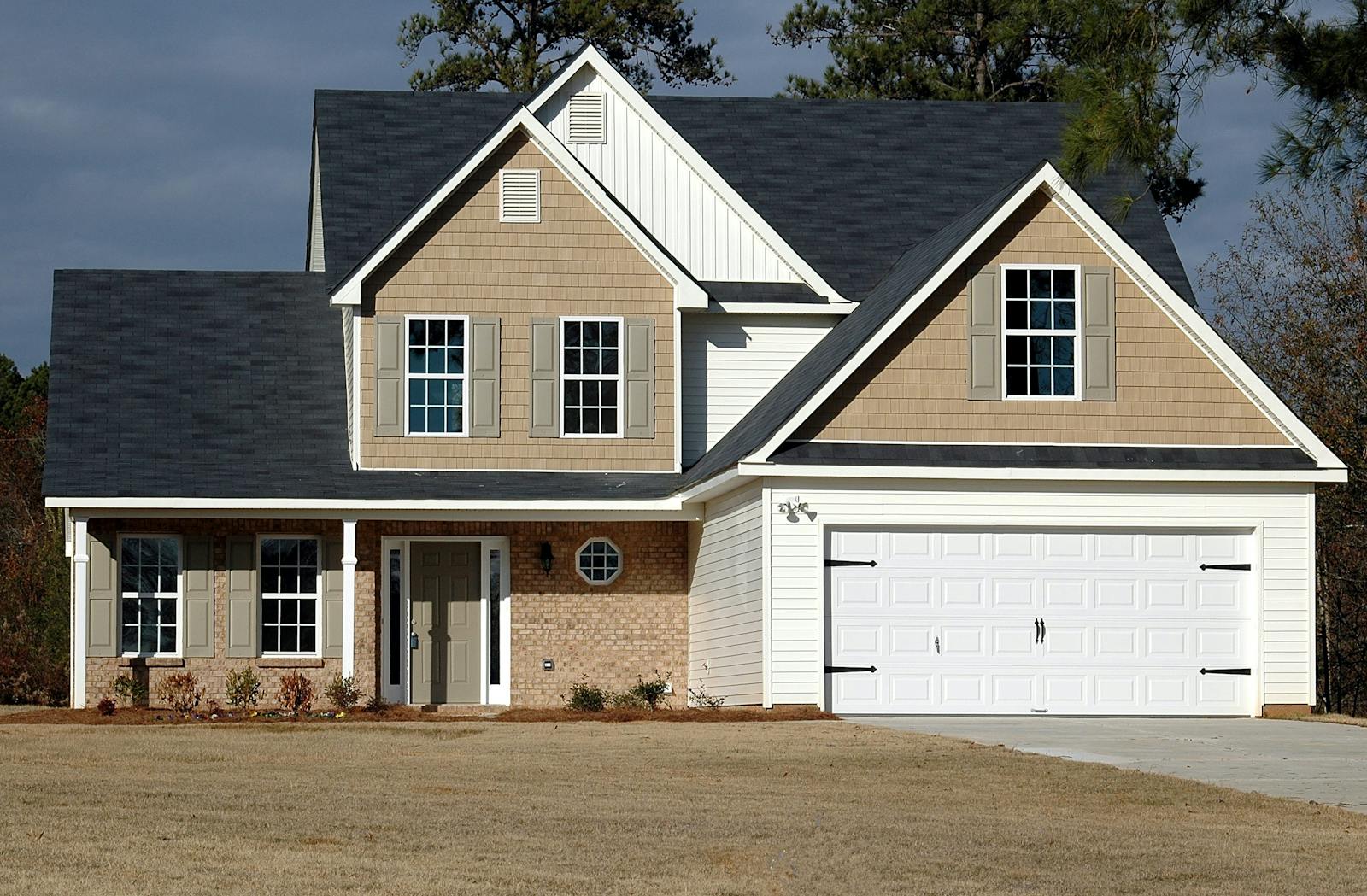 Elegant two-storey house with garage, showcasing modern architecture and residential charm.